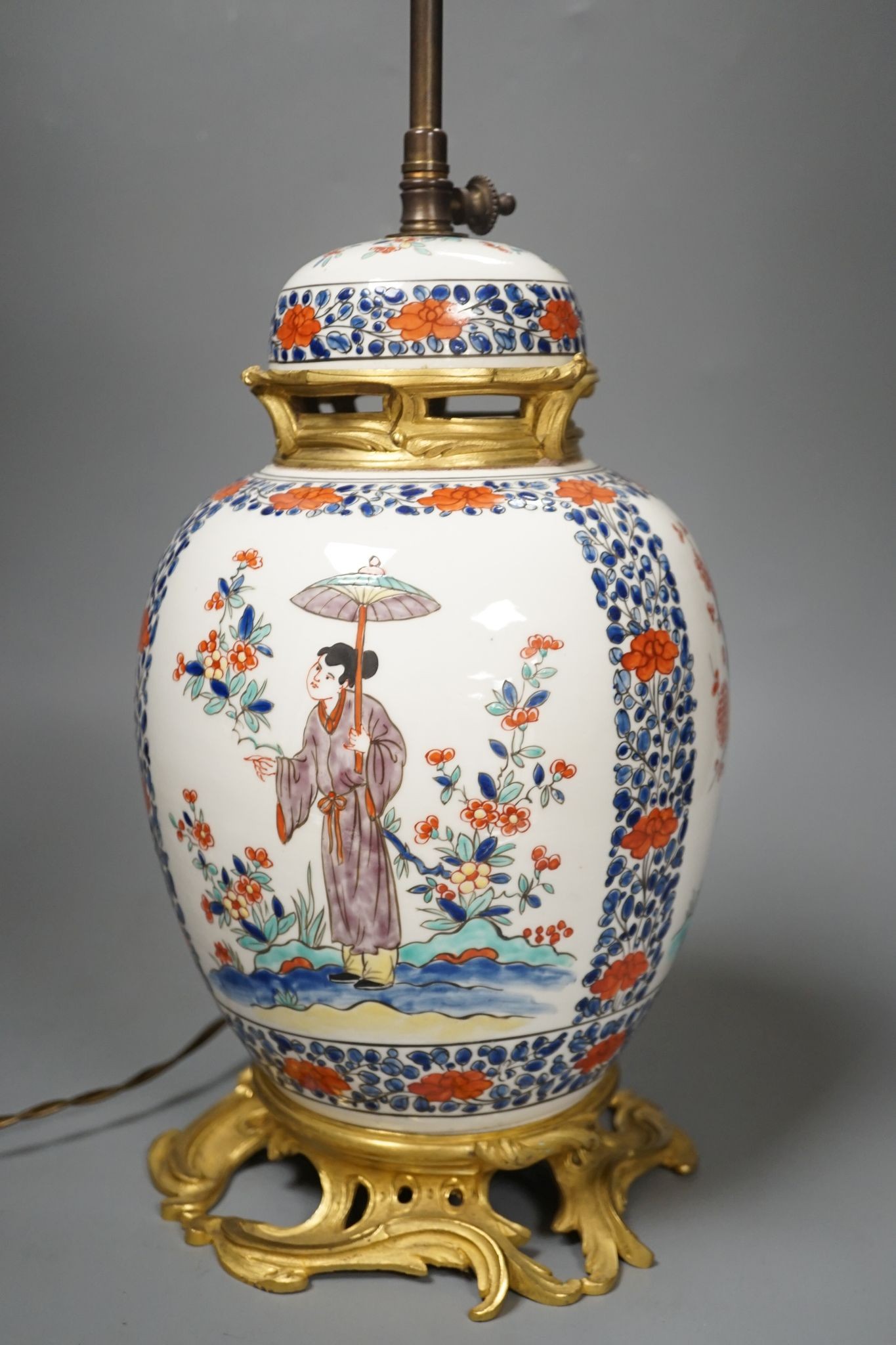 A European porcelain table lamp in the Oriental style, 63 cms high.